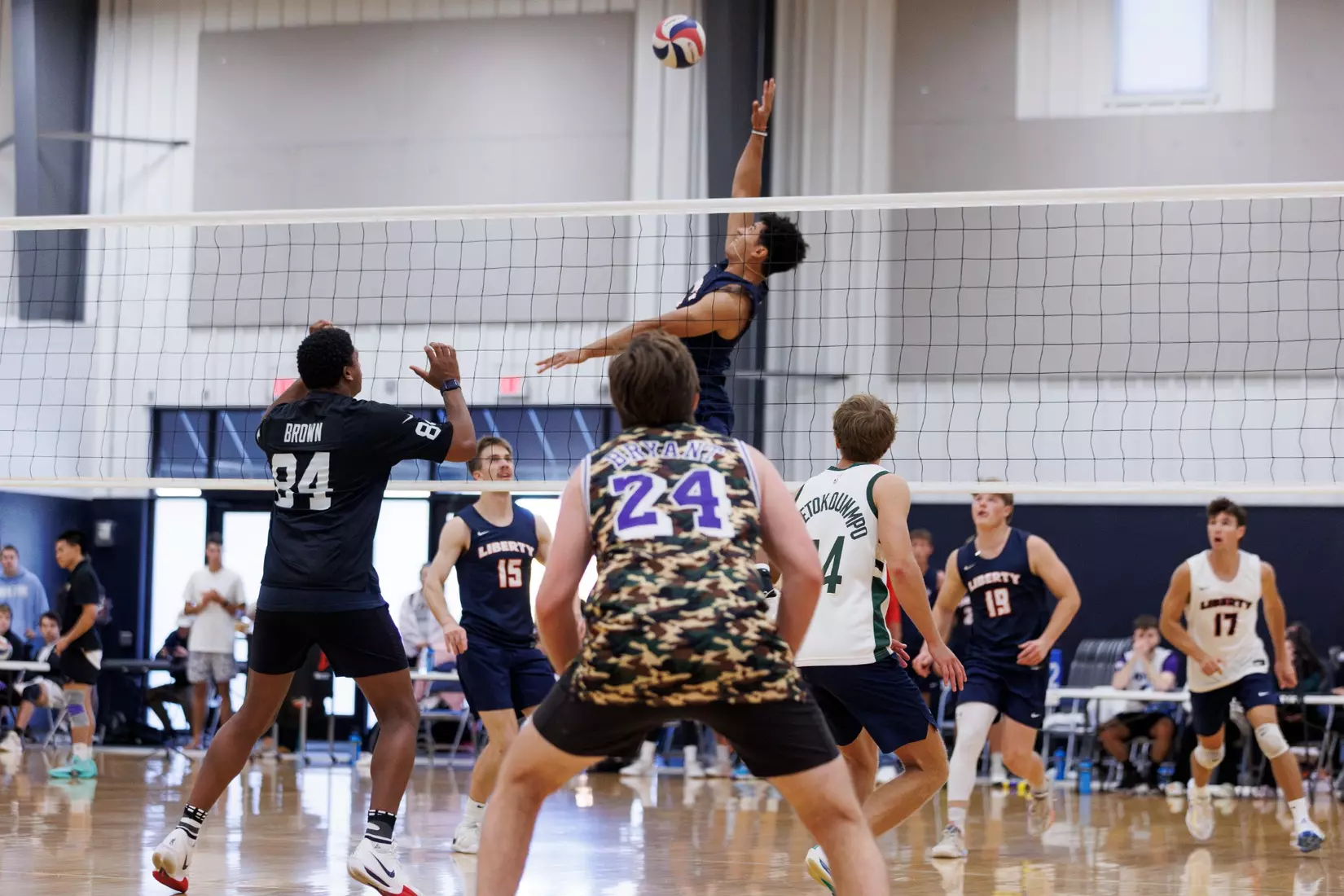The Liberty Men’s Indoor Volleyball team faces an LU Alumni team at the Preseason ECVF Tournament in the Lahaye Multipurpose Center on October 18th, 2025. (Photo by Grace Greer)