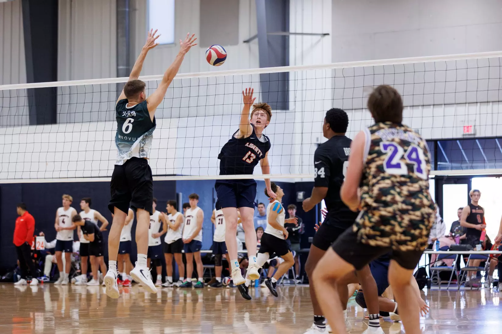 The Liberty Men’s Indoor Volleyball team faces an LU Alumni team at the Preseason ECVF Tournament in the Lahaye Multipurpose Center on October 18th, 2025. (Photo by Grace Greer)