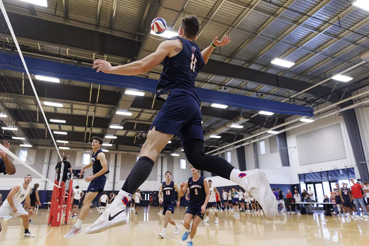 The Liberty Men’s Indoor Volleyball team faces an LU Alumni team at the Preseason ECVF Tournament in the Lahaye Multipurpose Center on October 18th, 2025. (Photo by Grace Greer)