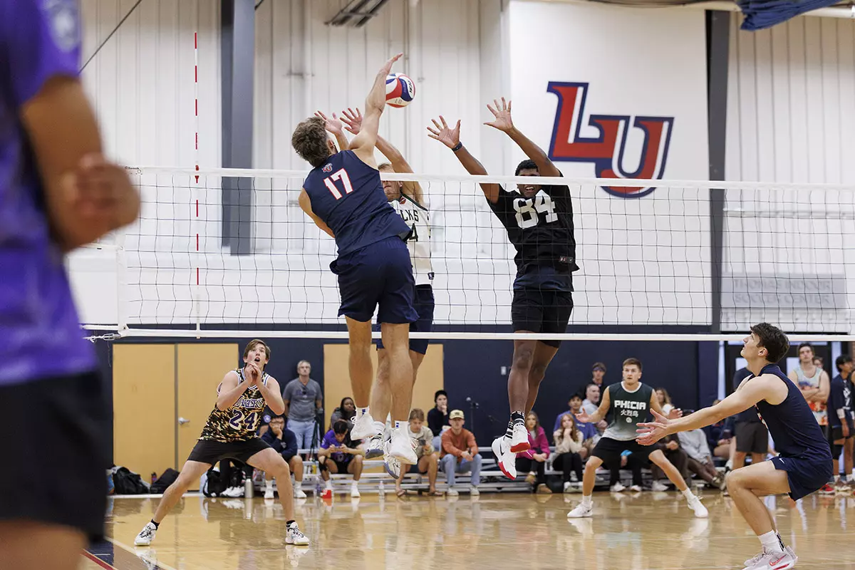 The Liberty Men’s Indoor Volleyball team faces an LU Alumni team at the Preseason ECVF Tournament in the Lahaye Multipurpose Center on October 18th, 2025. (Photo by Grace Greer)