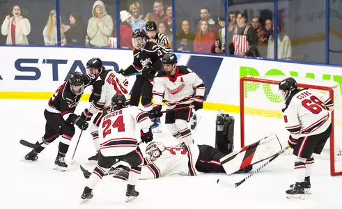 Sam Feamster drives on Beavers' cage