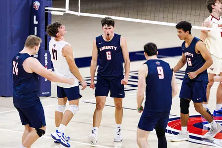 Men's volleyball huddle vs. VT