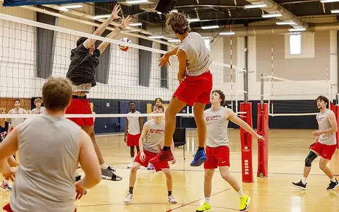 Jayden Rice spikes at practice