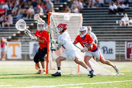 Keaton Mohs drives on Tigers' cage
