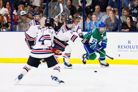 Kal Essenmacher contends with FGCU player