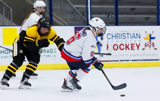 Sophia Adamek skates against Adrian College