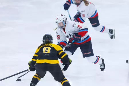 Brooke Olson and Ellie Sarauer break against Adrian