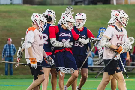 Flames forwards celebrate goal at Virginia Tech