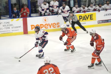 Ryan Finch drives against Virginia Tech hockey