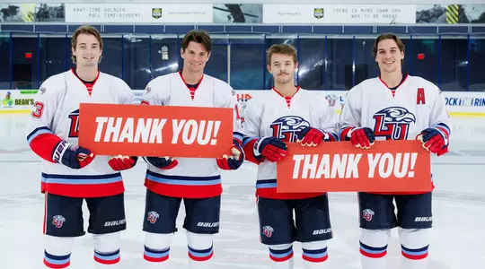 DI men's hockey Giving Day signs