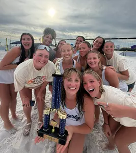 Women's beach volleyball with Club National Championship trophy
