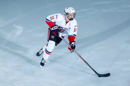 Tucker Shields skates after shot