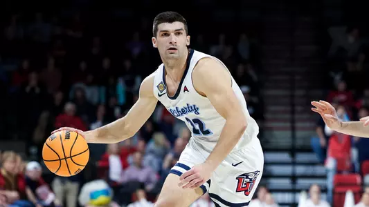 The Liberty Men’s Basketball team takes on Villanova in the first game of the NIT tournament on March 14, 2023. (Photo by Chase Gyles)