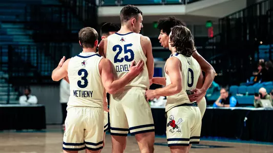 Men's Basketball Team Huddle Recap Photo vs. Furman