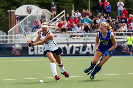 The Liberty Women's Field Hockey team faces off against Delaware on September 10, 2017. (Photo by Nathan Spencer)