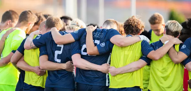 Men's Soccer Team Huddle