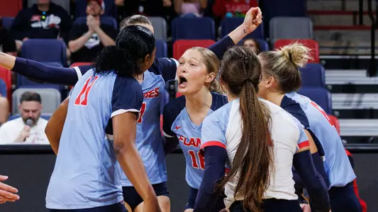 The Liberty University Women’s Volleyball team takes on West Virginia University in the Liberty Arena on September 15, 2024. (Photo by: Emily Cuthrell)