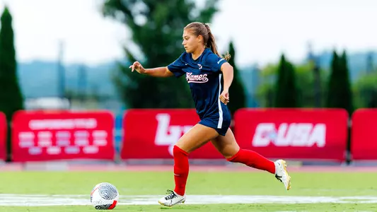 WSOC Graf dribbles a ball