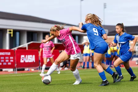WSOC Halle Engle fights off a defender