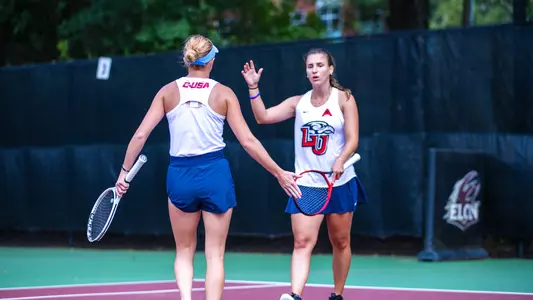 Women's Tennis, Daavettila and Radulova high-five after a point