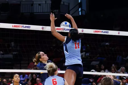 The Liberty University Women’s Volleyball team takes on West Virginia University in the Liberty Arena on September 15, 2024. (Photo by: Emily Cuthrell)