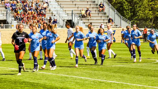 Women's Soccer runs off the field