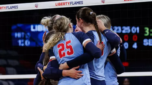 The Liberty University Women’s Volleyball team takes on West Virginia University in the Liberty Arena on September 15, 2024. (Photo by: Emily Cuthrell)