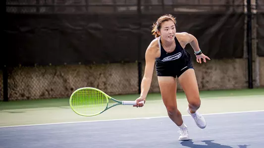 Candy Wai makes a lunging swing