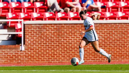 WSOC Bri Myers dribbles a ball