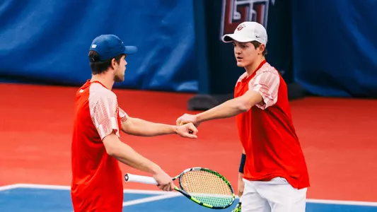 Gouws, Roothman congratulate after a point
