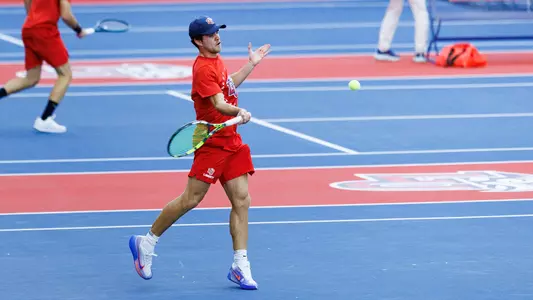 Roothman returns a shot