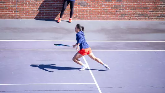 Chen attacks a shot at the net