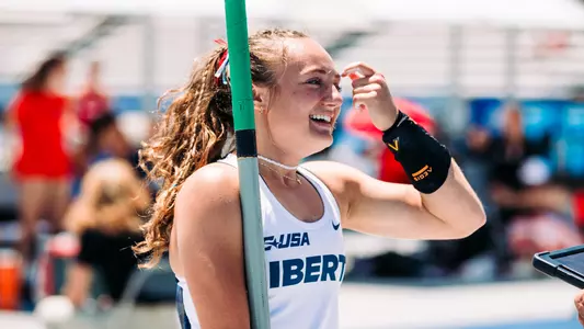 Katie Urbine Holding Pole Vault, Smiling