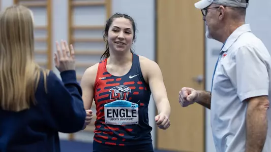 Meredith Engle High Fives after High Jump