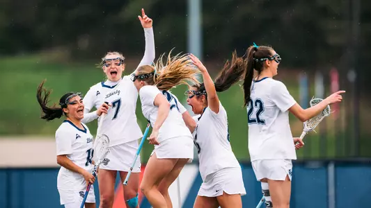 WLAX Team celebrates a goal