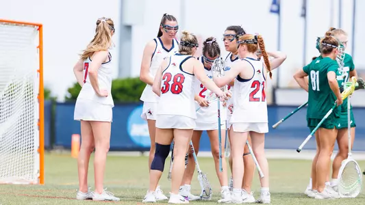 WLAX Huddles after a goal