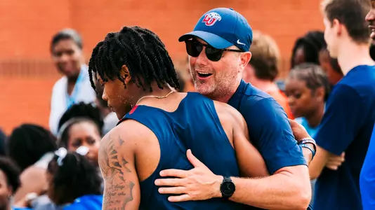 Markus White and Shawn Venable Hug