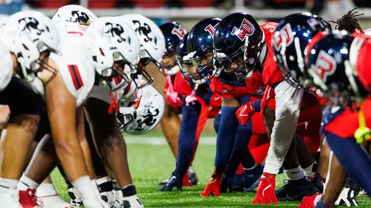 Football - Liberty vs. Jax State Game Day Central Story (Photo of Liberty Offensive Line vs. Jax State Defensive Line)