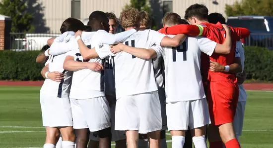 Men's Soccer - Liberty on field in huddle before start of game