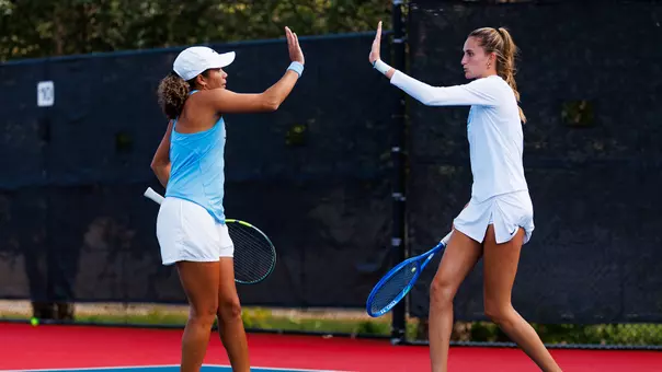Women's Tennis Daniella O'Neill and Aranai celebrate after a point
