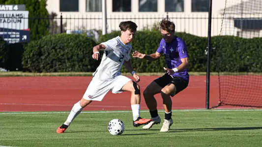 Men's Soccer - Goncarlo Sousa Moves Past a Defender