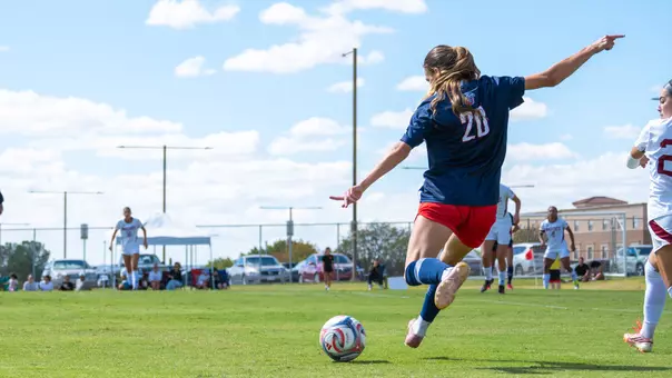 Women's Soccer Carly Keene strikes a free kick in a game at New Mexico State