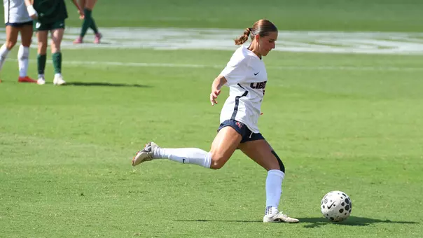 Women's Soccer Sallie Garner Kicks a ball in a game at Osborne Stadium