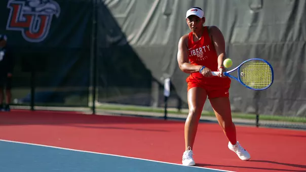 Women's Tennis Celina Joseph hits a backhand at practice