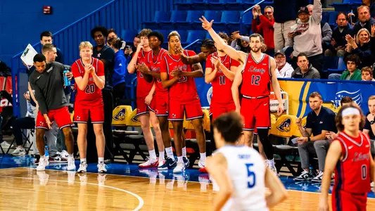 Men's Basketball Recap Photo Team Bench Celebration at Delaware 2-4-26