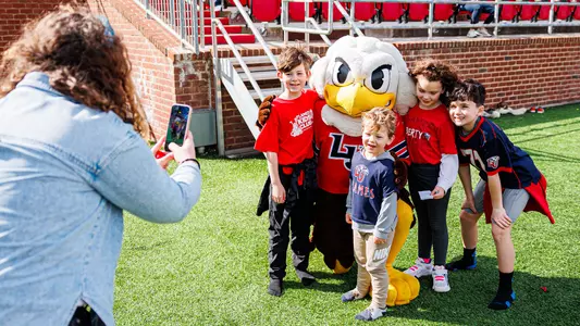 Football - Flames Fans With Sparky During Spring Football Game