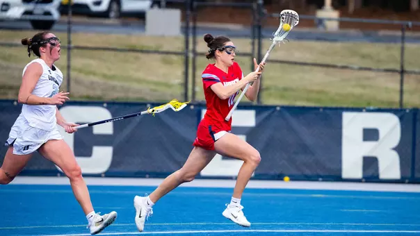 WLAX Nina Gray runs with the ball