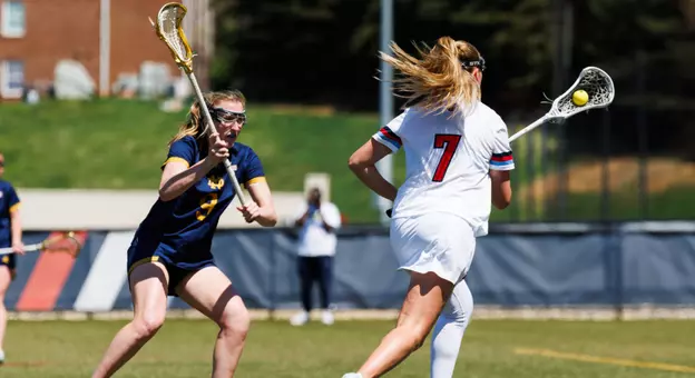 WLAX Young runs with the ball