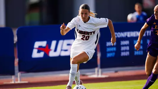 Women's Soccer's Carly Keene dribbles the ball in a game against East Carolina on Aug. 13, 2026 from Osborne Stadium