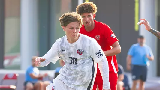 Men's Soccer - Ronnie Gorman passes a Radford Player 8-12-26